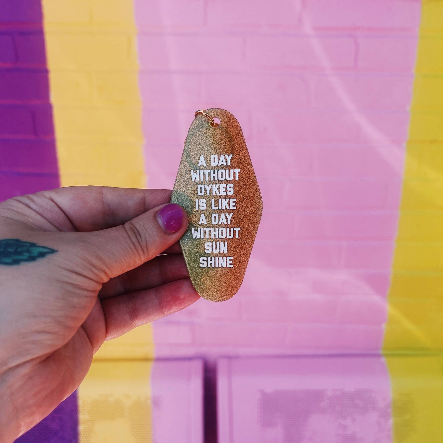 A Day Without Dykes Motel Keychain